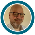Profile picture for Dr Tim Kilner ( bold, white man, with round glasses and beard, smiling and looking into the camera)